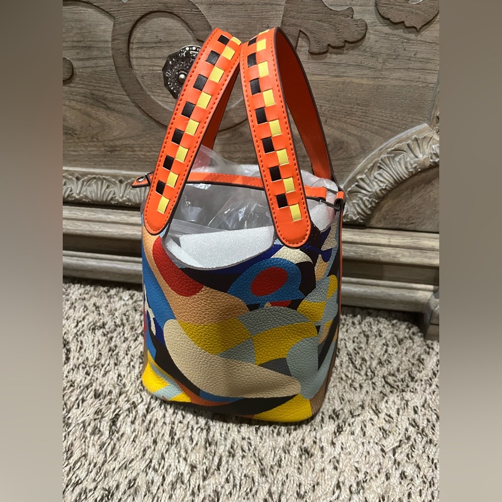 Orange and Yellow Shoulder Bag with Vibrant Design. H inspired bucket bag